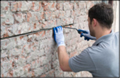 Showing how to brick stitch a cracked wall