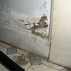 A picture showing damp plaster due to rising damp