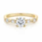 Gold ring with round diamond and side stones