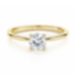 Gold ring with round diamond in four-prong setting