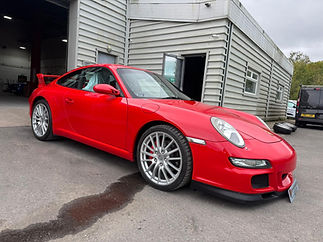 Red sports car showcasing professional vehicle restoration