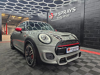 White Mini car receiving professional body repair in Sheffield