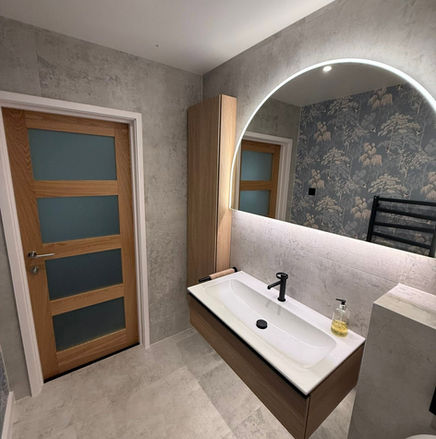 Wall mounted sink with arch mirror