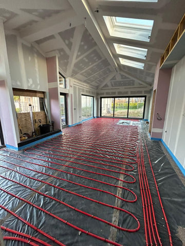 Water pipes installed for underfloor heating 