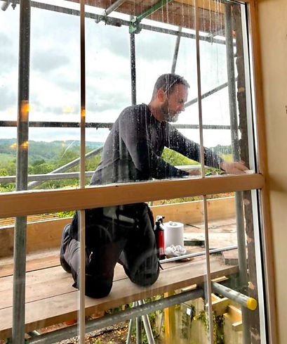 misted window being repaired by tradesman
