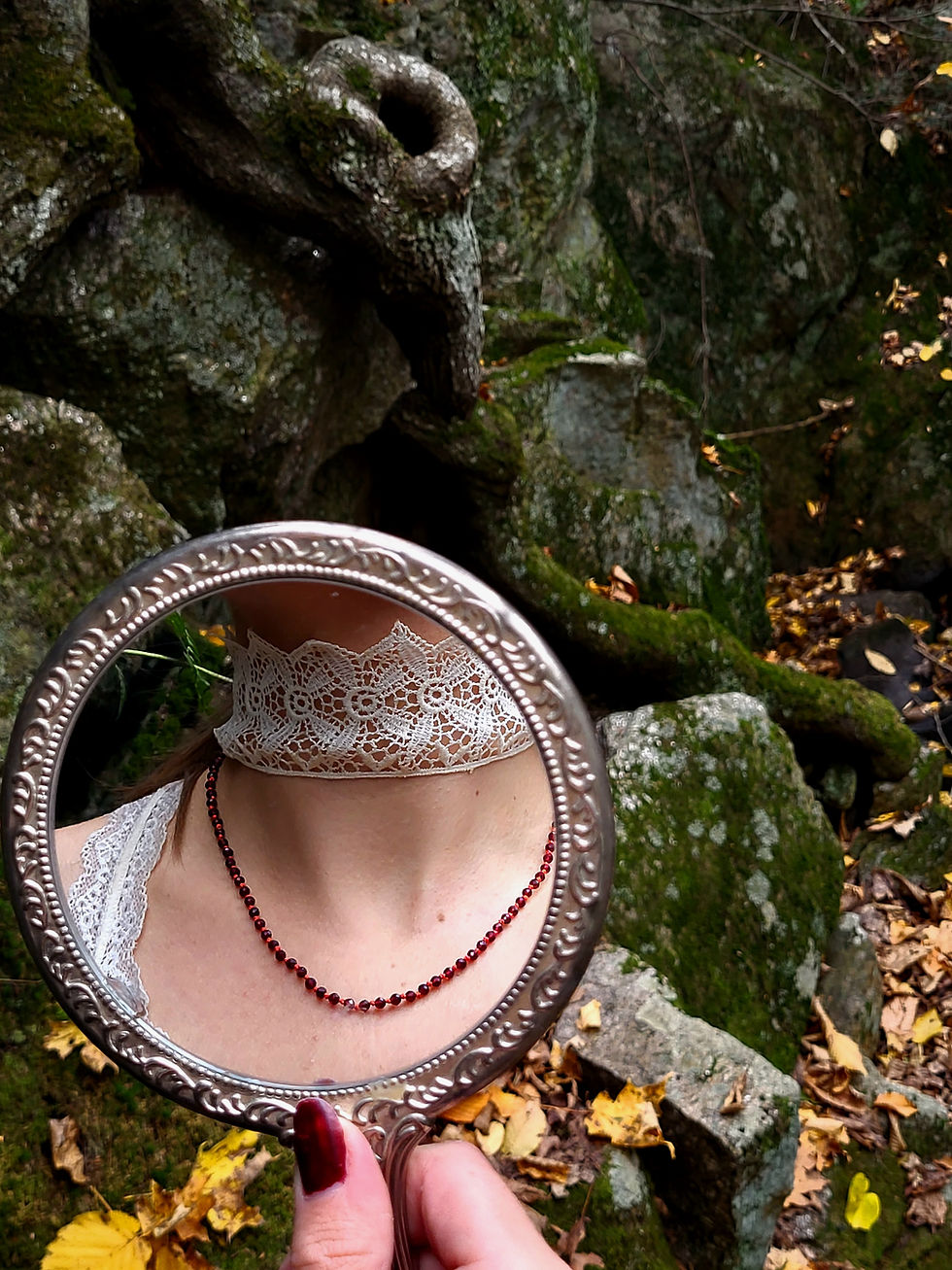 Thumbnail: Red garnet beaded necklace worn on a neck reflected in a mirro