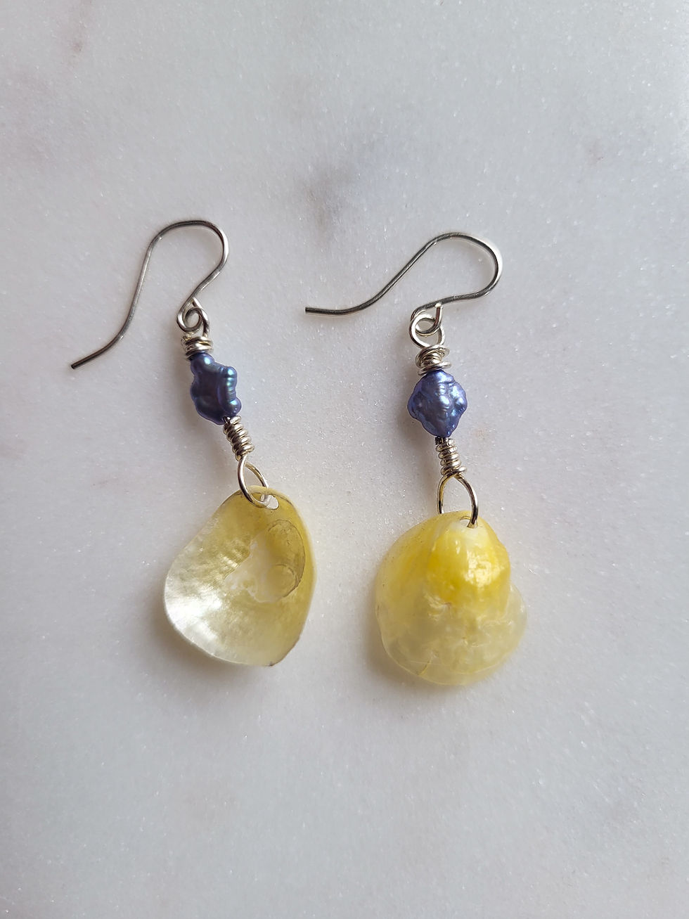 Thumbnail: Silver jingle shell drop earrings with blue baroque pearls
