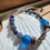 Thumbnail: Seashell hemp bracelet with labradorite and lapis beads and blue glass beads