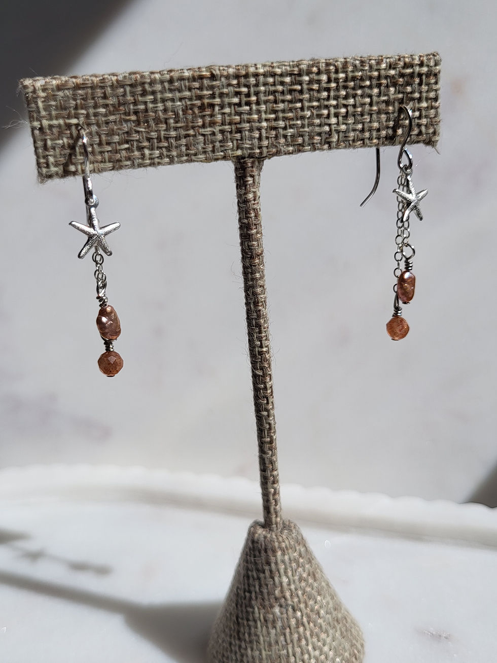 Thumbnail: Sterling silver dangle earrings with silver starfish, sunstone beads, freshwater pearls