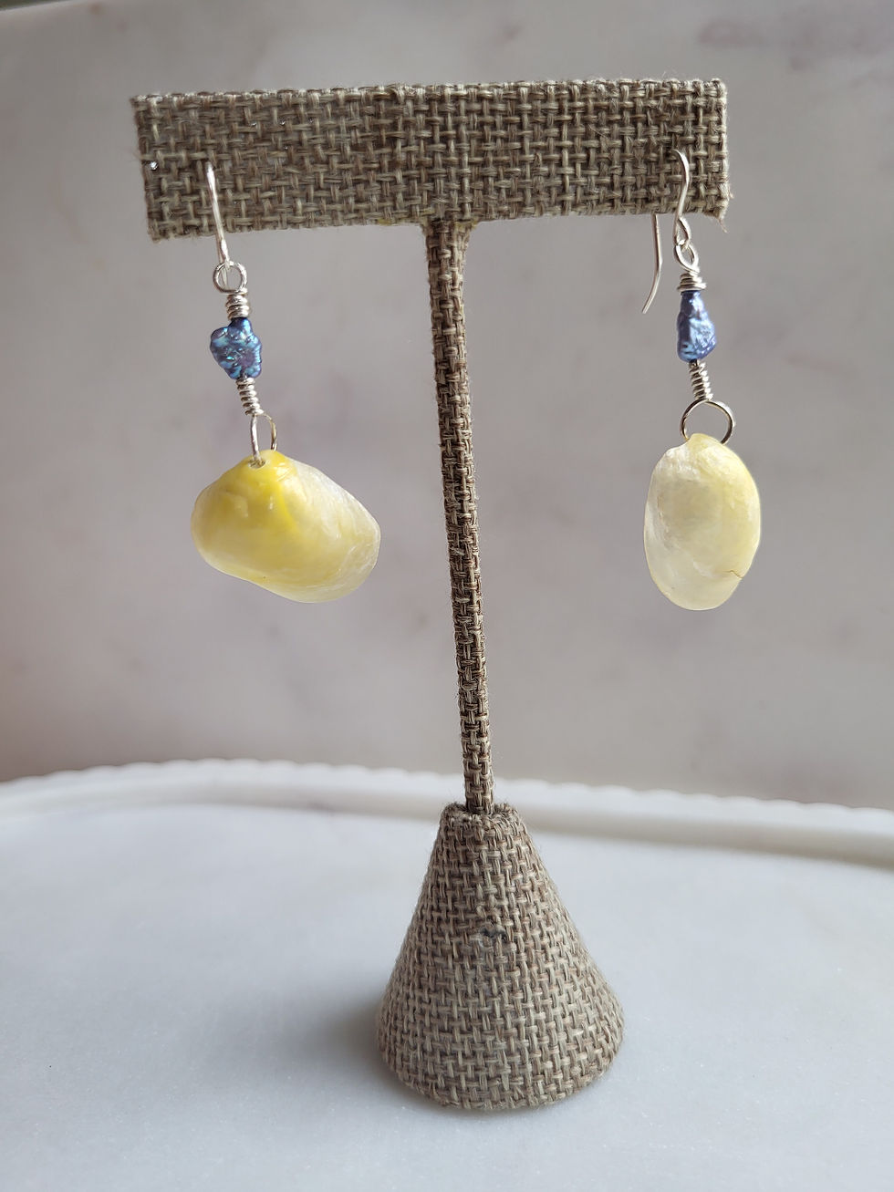 Thumbnail: Silver jingle shell drop earrings with blue baroque pearls