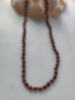 Red garnet beaded necklace on red silk knotted cord