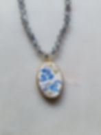 Beaded labradorite necklace with hand painted ceramic pendant depicting blue clouds and gold stars