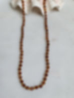 Orange hessonite gemstone beaded necklace hand knotted on yellow gold silk cord