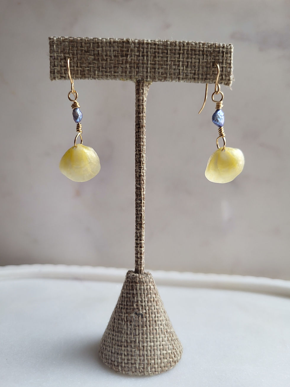 Thumbnail: Gold jingle shell drop earrings with blue baroque pearls