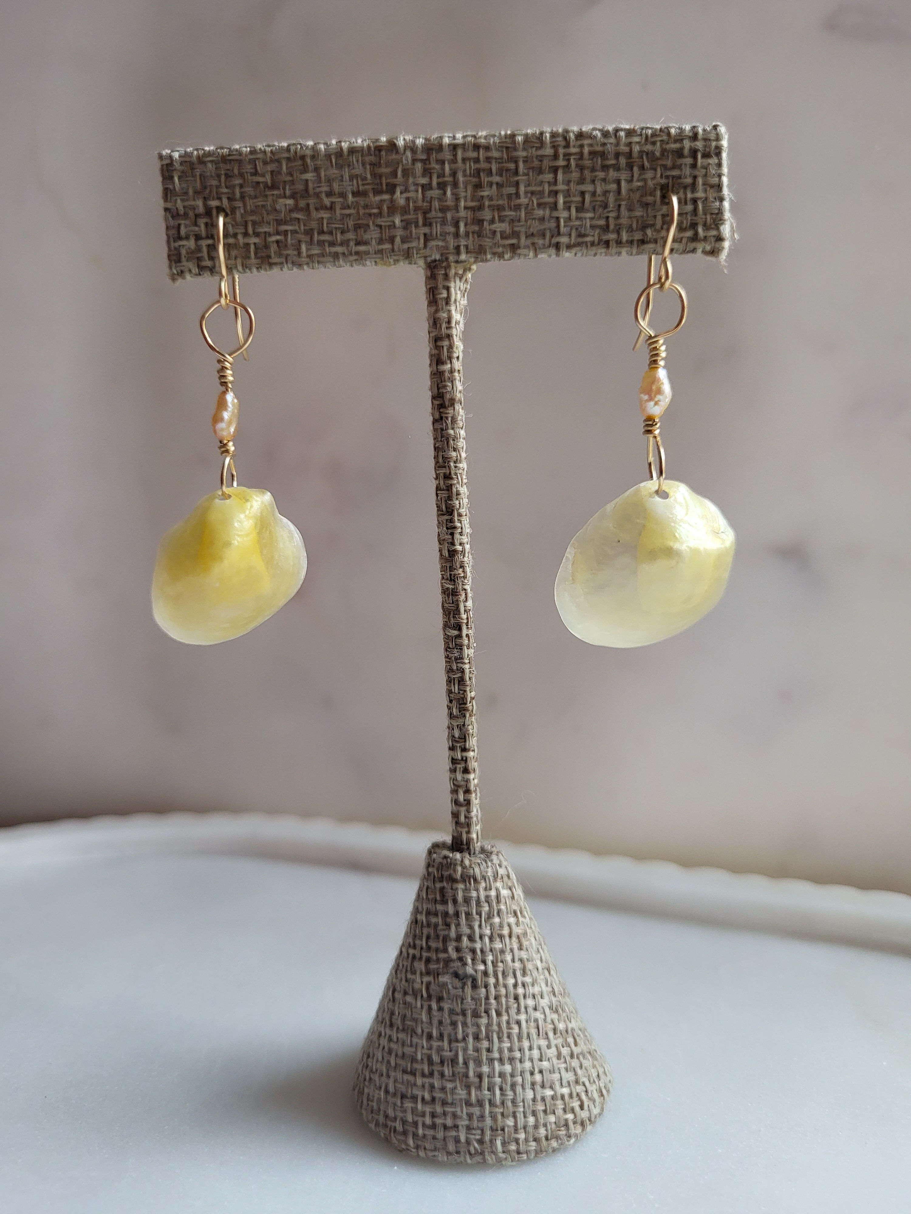 Gold jingle shell drop earrings with pink baroque pearls