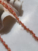 Beaded sunstone necklace with hand knotted coral silk cord