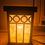 Miniatura: Uma elegante luminária de antiquário com design vintage, apresentando detalhes ornamentais em metal e um acabamento em vidro fosco, iluminando suavemente o ambiente com um toque clássico