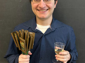 Sam Stea, M.Sc. holding a Buzz Bar Bouquet