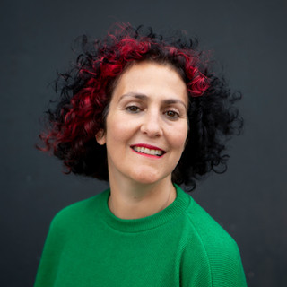 Benita headshot 2020 green top mouth clo