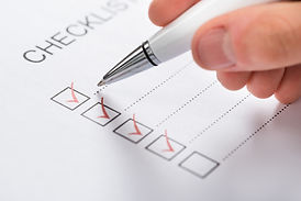 Man checking off items on a checklist