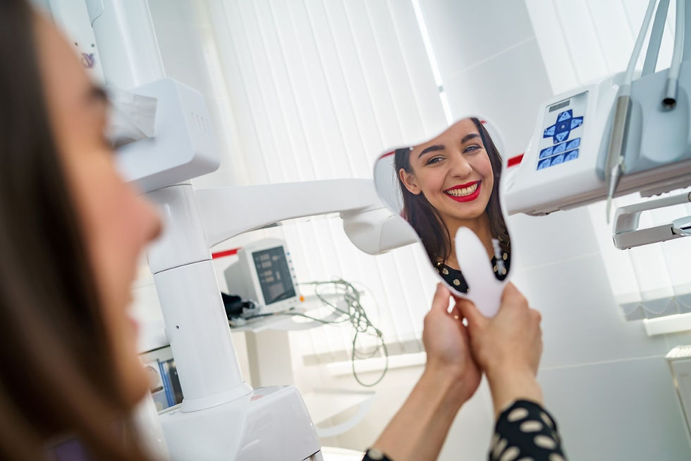 view-from-side-happy-female-patient-looking-mirror-enjoying-beautiful-smile-dental-office-