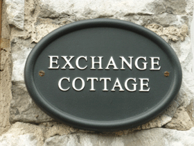 Exchnage Cottage wall plaque in Tideswell, Derbyshire, UK