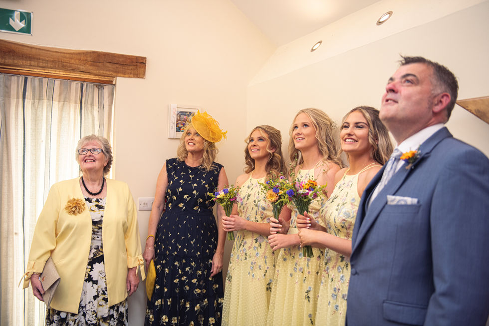 Bridesmaids wait for the bride at Ceridwen Centre, Carmarthenshire by Swansea Wedding Photographer Katy Tainton Photography