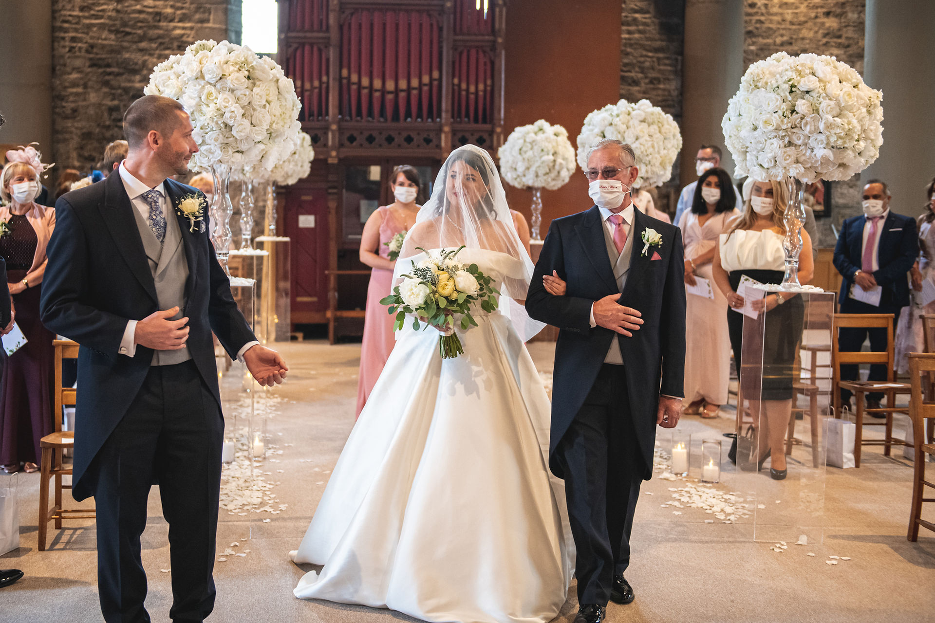 The groom sees the bride for the first time at a wedding at Canada Lodge & Lake, Cardiff, by Swansea wedding photographer Katy Tainton Photography