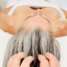 Client receiving intraoral buccal massage in Franklin TN for TMJ pain relief, jaw relaxation, and reduction of facial tension.