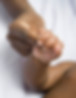 Parent holding baby's hand