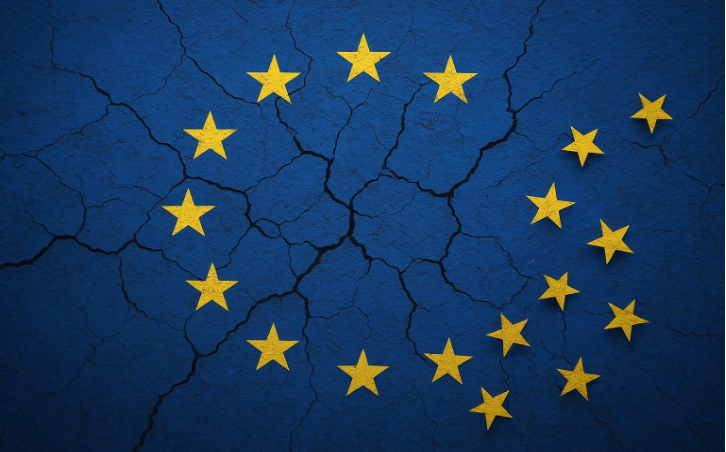 EU flag with cracked pattern; 12 yellow stars on a blue background. The cracks suggest division or tension.
