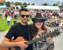 Professional acoustic duo entertaining event guests