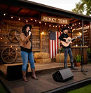 Husband and wife country duo performing live on stage