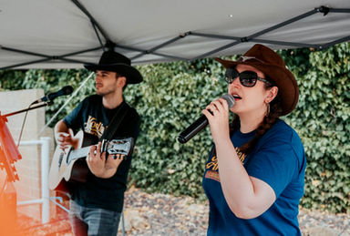 Acoustic country duo live performance at a country music celebration event