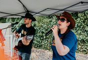 Bride and groom enjoying live acoustic music during a Shropshire wedding ceremony