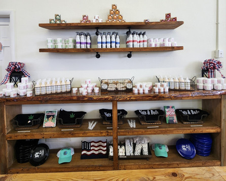 nuts and buds CBD lotion and soaps on shelves.jpeg