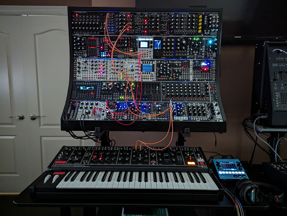 Wooden Uryan Eurorack case with a patched modular system and keyboard