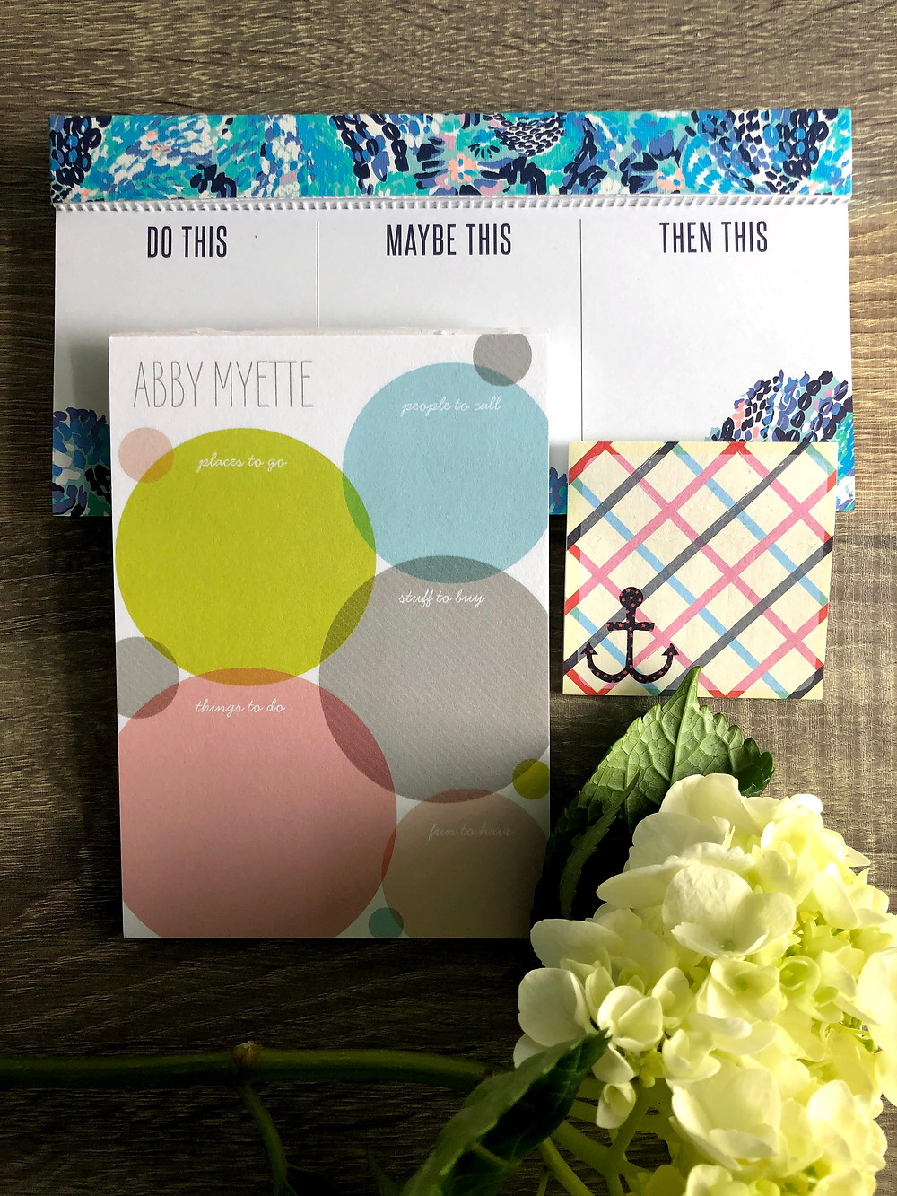 Three different notepads for organizing tasks.