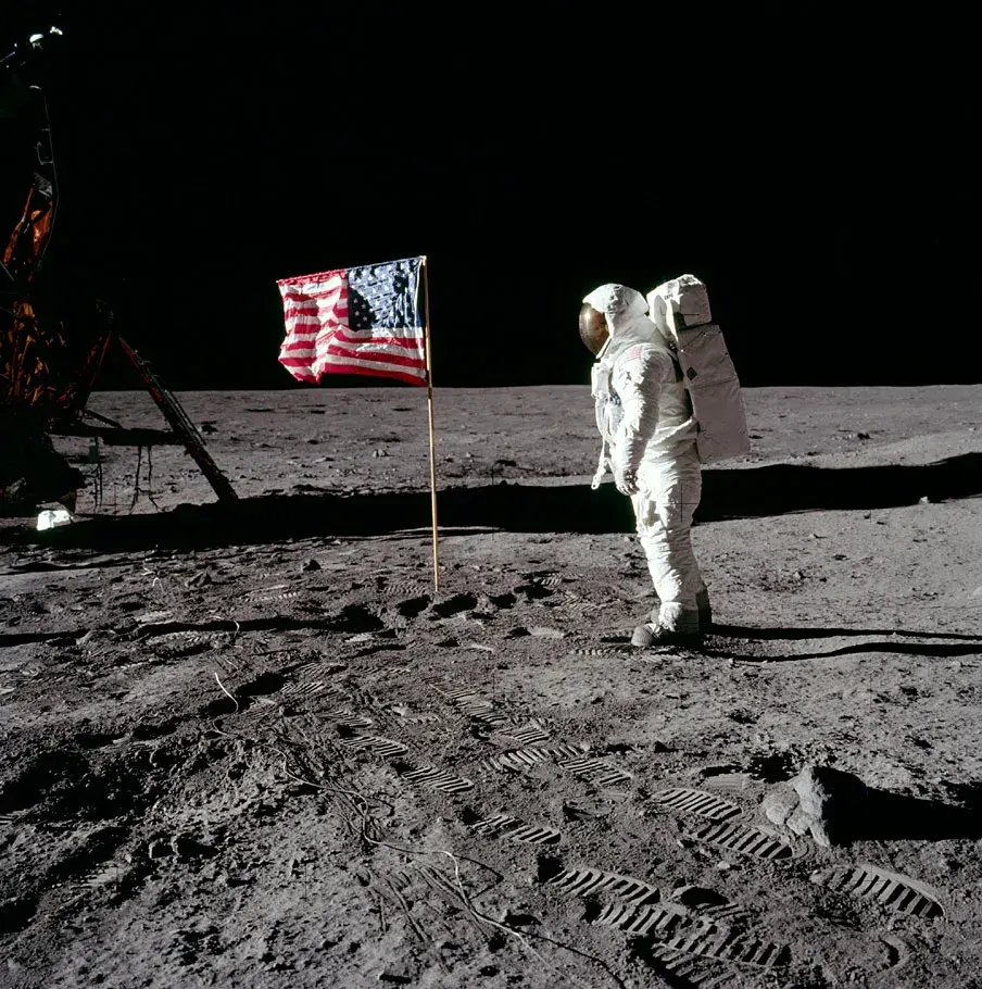 Buzz Aldrin standing next to the American Flag. Photo Credit: NASA