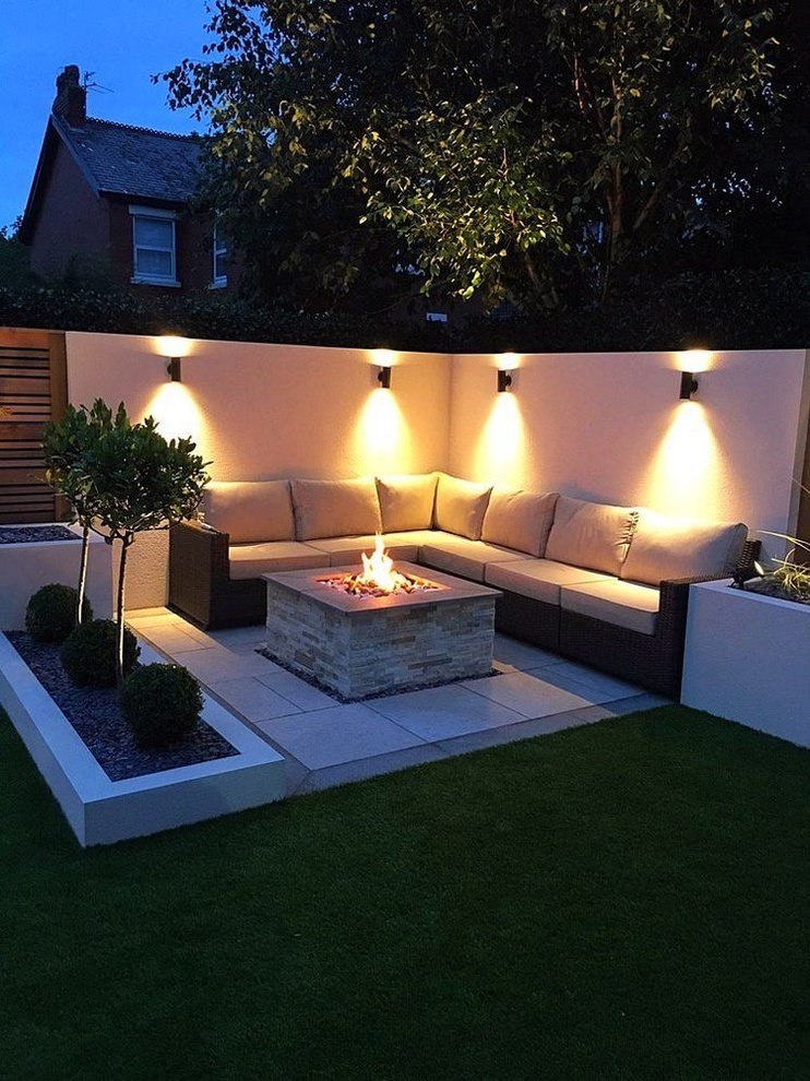 an outdoor living area with couches