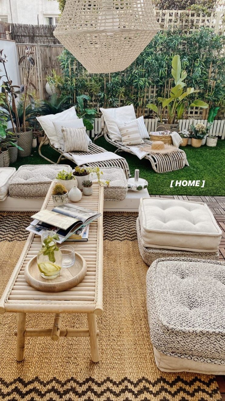 an outdoor living room with couches