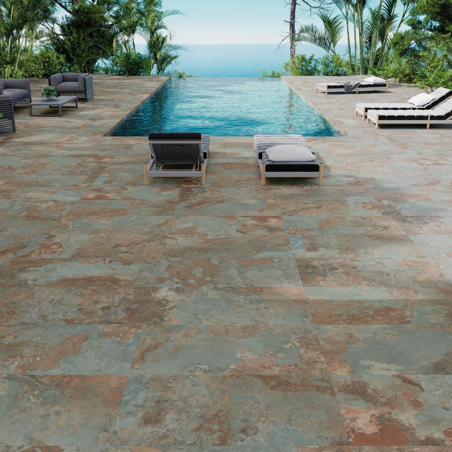 an outdoor swimming pool with lounge chairs next to it