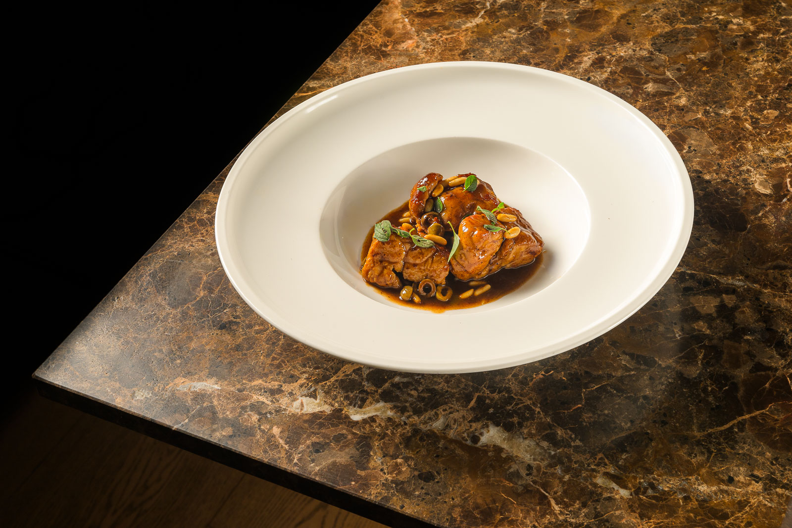 Animelle grigliate gourmet con pinoli e olive taggiasche