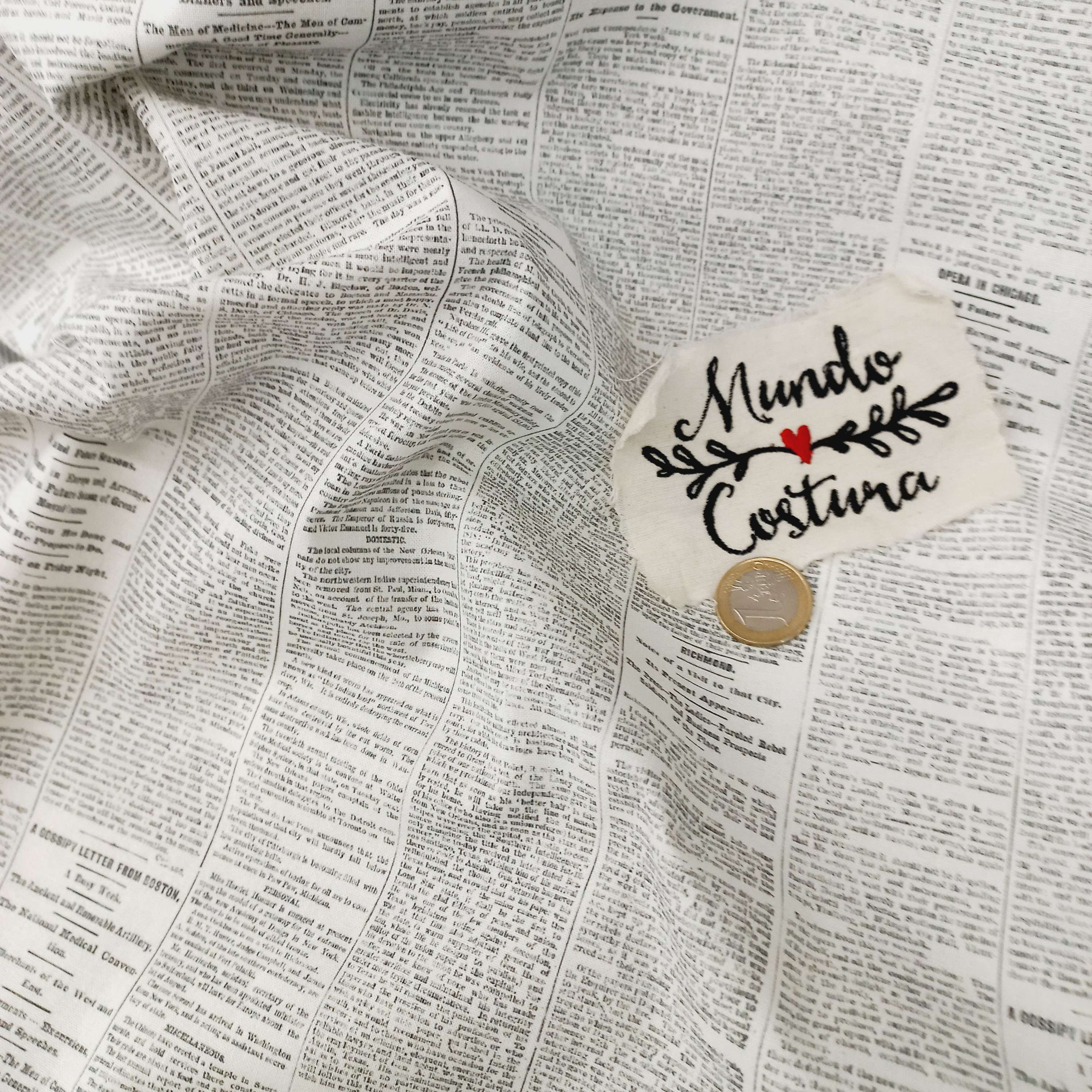 Popelín estampado periódico