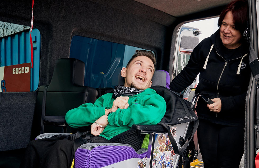 Picture shows Tyler with mum Teresa in their specially adapted vehicle.