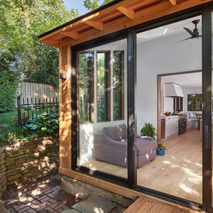Sliding glass door and slate patio.