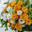 サムネイル： オレンジ系の豪華なアレンジメント