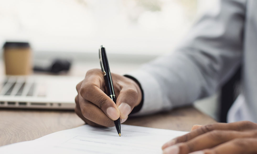 Person signing paper