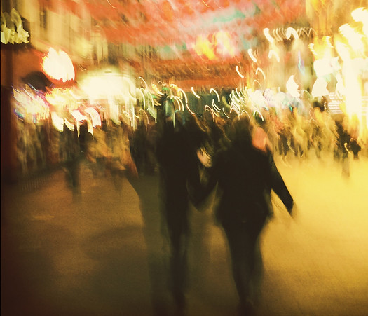In this image, on the wide avenue of a great city, people, back view, run toward the scene of the physical resurrection of the representatives of the Two Witnesses, who then suddenly begin to visibly ascend to heaven in response to the heavenly voice which says: “Come up here.”