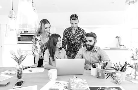 cheerful-team-workers-with-laptop_edited